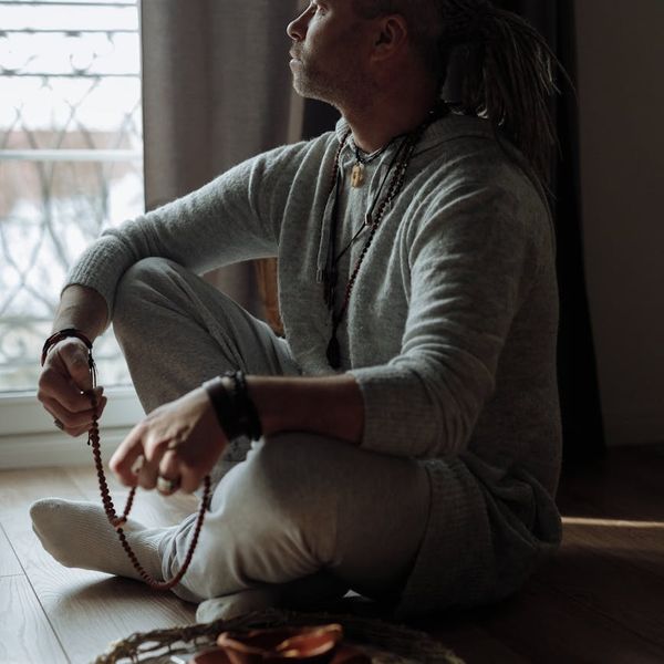 Person looking at a bright horizon, symbolizing clarity and well-being.