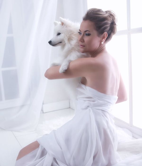 Woman with a calm expression, focusing, with lime green light accents.